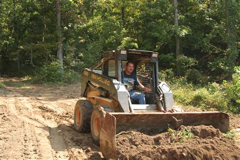 building a pond with a skid steer|skid steer loader.